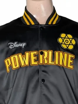 A flat-lay view of the Disney Powerline Tour bomber jacket on a hanger, showing the rib-knitted collar and cuffs.