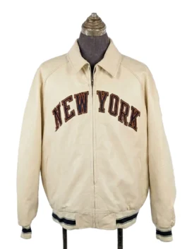 Front view of a full-zip jacket with a classic pointed collar, showcasing large varsity-style text arched across the chest.