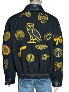 Detailed embroidery of various basketball team logos on a sleek jacket