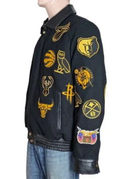 Premium black leather jacket with colorful embroidered sports insignias