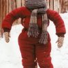 A Christmas Story snow suit costume featuring Randy wrapped in a restrictive red snowsuit and scarf.