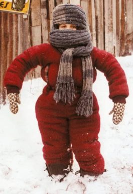 A Christmas Story snow suit costume featuring Randy wrapped in a restrictive red snowsuit and scarf.