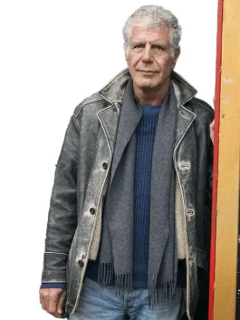 Anthony Bourdain wearing his iconic long grey Anthony Bourdain utility jacket with a knit scarf.