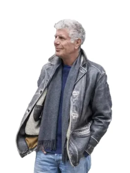 Side profile of Anthony Bourdain wearing his distinct grey Anthony Bourdain field jacket over a scarf.