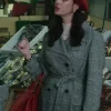 Kaya Scodelario Plaid Trench Coat trench coat and red beret, completing her stylish plaid coat look in a marketplace scene.