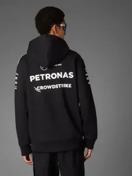 Back view of the black Adidas Mercedes AMG Petronas Formula One Team hoodie, featuring large PETRONAS and CROWDSTRIKE logos.