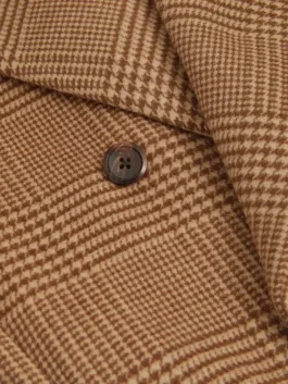 Ryan Eggold wearing the brown wool coat in a scene from the My Secret Santa movie.