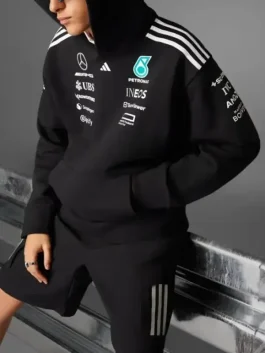 Close-up side view of the black Adidas x Mercedes F1 racing hoodie for men, showing sleeve and chest sponsor details.