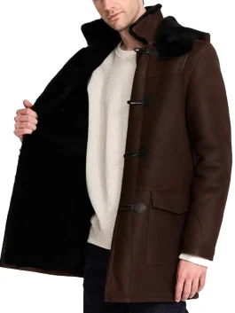 Long brown shearling sheepskin coat for men with black fleece lining and a classic toggle front.