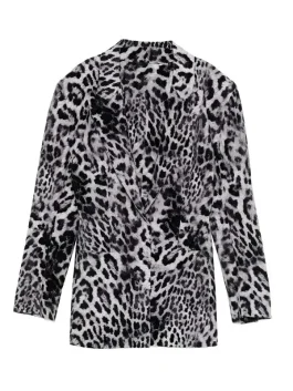 Front view of Ashley Park in a stylish grey leopard printed blazer with sharp lapels.