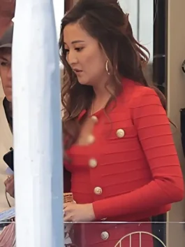 Ashley Park as Mindy Chen in Emily in Paris Season 5 wearing a coordinated red Retrofete knitted outfit.