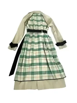 Lily Collins wearing a Plaid Trench Coat in a striking emerald and forest green check pattern.