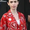 Lily Collins wearing a vibrant Red Paisley Shirt with intricate teardrop patterns in Emily in Paris S05.