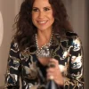 Minnie Driver as Elizabeth Robertson in Emily in Paris S05 wearing a black and blue jacquard blazer.