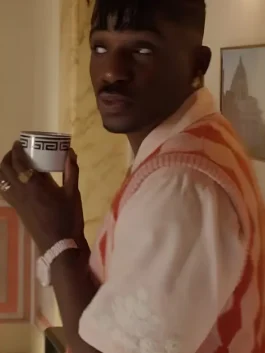 Samuel Arnold wearing a vibrant fuchsia V-Neck Sweater Vest in a scene from Emily in Paris S05.