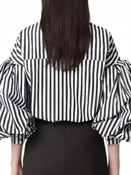 Back view of the striped puff sleeve shirt worn by Lily Collins on the show.