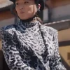 Ashley Park wearing a trendy grey leopard printed blazer in Emily in Paris Season 5.