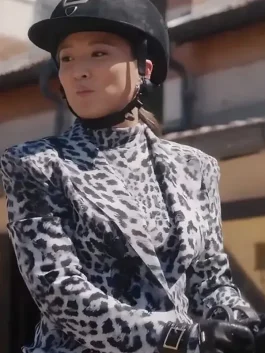 Ashley Park wearing a trendy grey leopard printed blazer in Emily in Paris Season 5.