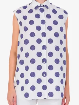 Lily Collins wearing a classic polka dots poplin top in Emily in Paris Season 5.