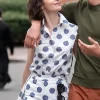 Lily Collins showcasing a trendy polka dots top from the hit series.