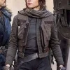 A women’s olive green tactical vest worn over a grey jacket with ribbed sleeves, inspired by Jyn Erso.