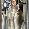 A woman wearing an off-white quilted rebel vest with a high neck, inspired by Princess Leia.