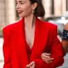 Emily in Paris Season 5 Lily Collins red wool coat with a belted waist.