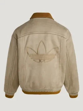 A back-view studio shot of a tan Adidas Chinese New Year crafted jacket. The jacket features a large, tonal embroidered Trefoil logo in the center and a contrasting brown corduroy collar. The silhouette is a relaxed, bomber-style fit with a ribbed brown hem.