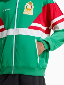 Front view to show the collar shape and zip line clearly. This Mexico 1986 track jacket looks sharp when fully zipped and relaxed when worn open. Match it with neutral bottoms so the green stands out. Ideal for everyday wear, casual meetups, and quick trips. Easy for layering in spring and fall.