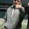 Christian Bale wearing the Al Davis Madden 2026 grey jacket with a sleek collar.