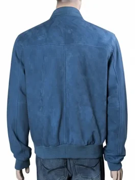 Close-up of a premium blue suede bomber jacket highlighting the rib-knitted cuffs and smooth zipper closure.
