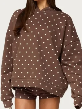 Front view of brown Chelsie polka dot hoodie. Earthy chocolate brown with cream spots for a 2026 retro look.