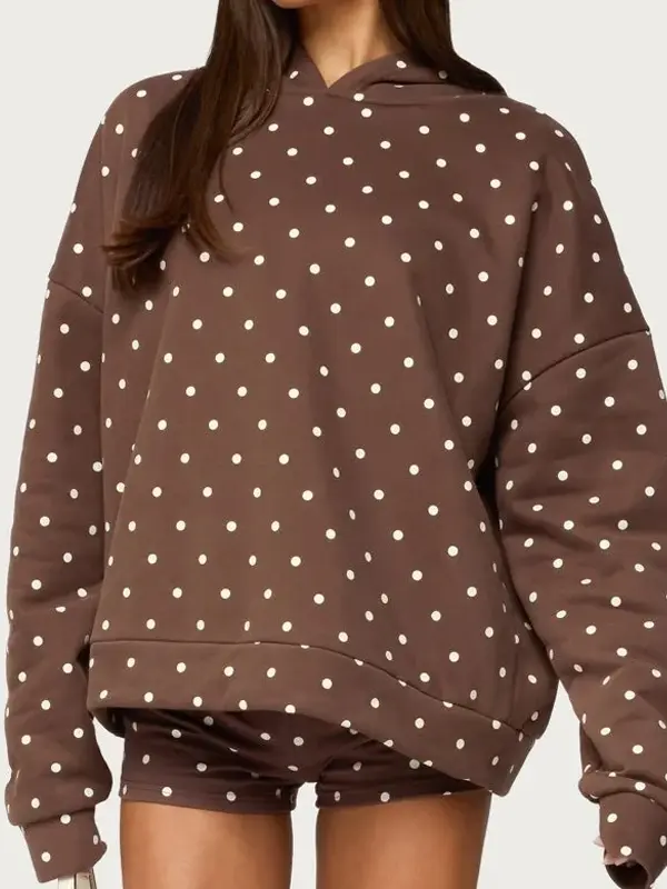 Front view of brown Chelsie polka dot hoodie. Earthy chocolate brown with cream spots for a 2026 retro look.
