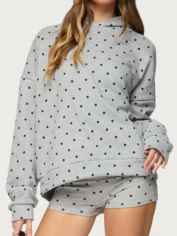 Front view of grey Chelsie polka dot hoodie. Modern heather grey with white spots and a cozy oversized fit.