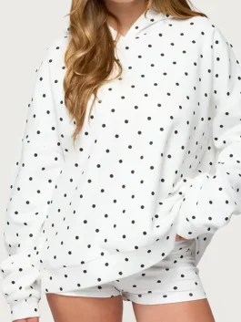 Front view of white Chelsie polka dot hoodie. Bright white with black spots for a clean, viral 2026 aesthetic.
