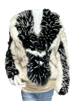 Front view of a bold black-and-white patterned jacket featuring an oversized shawl collar and long shaggy texturing.