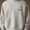 An oversized Fear of God Light Grey Hoodie with a minimalist streetwear design.