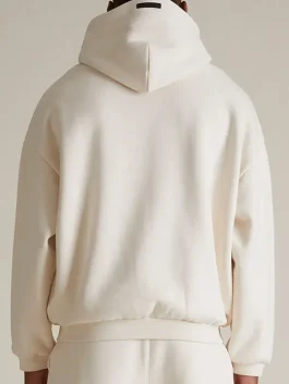 A comfortable Essentials Cream Hoodie made from high-quality heavy-weight fabric.