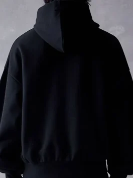 A warm Essentials Jet Black Hoodie made from thick, soft fleece material.