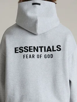 A relaxed Essentials Light Heather Grey Hoodie featuring an oversized streetwear fit.