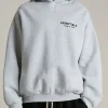 Front view of the Essentials Light Heather Grey Hoodie with a clean kangaroo pocket.