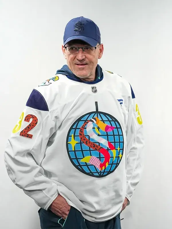 Front view of Seattle Kraken Pride Jersey featuring the iconic "S" logo in rainbow colors and modern V-neck design.