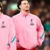 A Z.N.E Anthem Jacket Pink for men featuring the Liverpool FC crest.