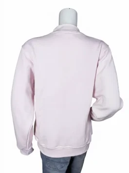 A woman modeling a vibrant red Parke Valentines Day varsity mockneck sweatshirt with 