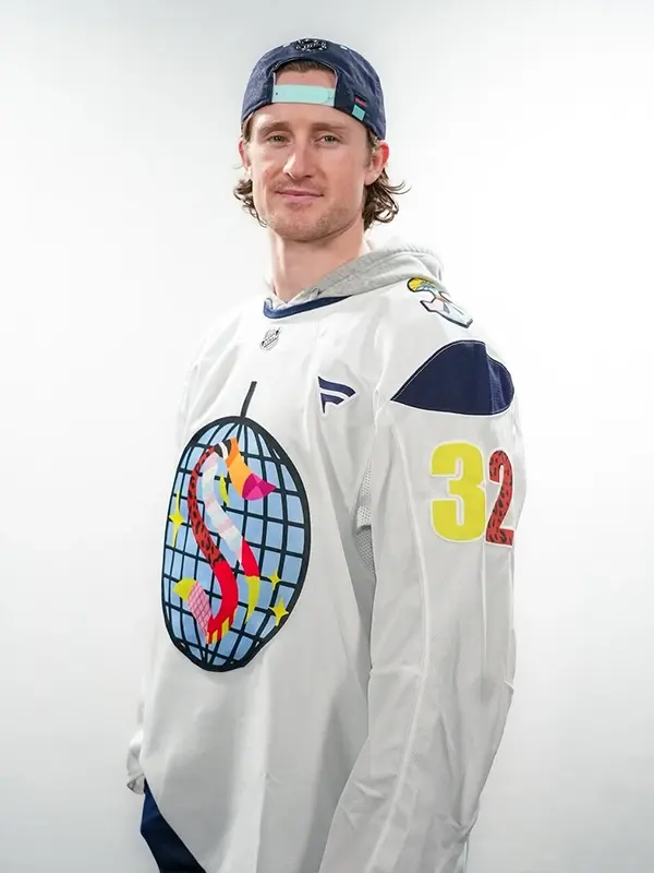 Left side profile of the Seattle Kraken Pride Jersey, showcasing the artist-inspired sleeve patterns and flexible fit.