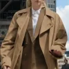 Front view of Steal 2026 Sophie Turner trench coat showing long length, belt waist and clean collar style