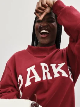 A full shot of the Valentines Day Varsity Mockneck Sweatshirt in a beautiful festive theme.