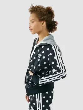 An adidas polka dot jacket made of polyester featuring a unique and playful pattern.