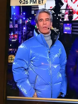 Close up view of Andy Cohen blue puffer jacket New Year 2026 showing quilting and fabric texture.