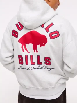Lifestyle shot of a model wearing the Buffalo Bills hoodie styled with jeans.